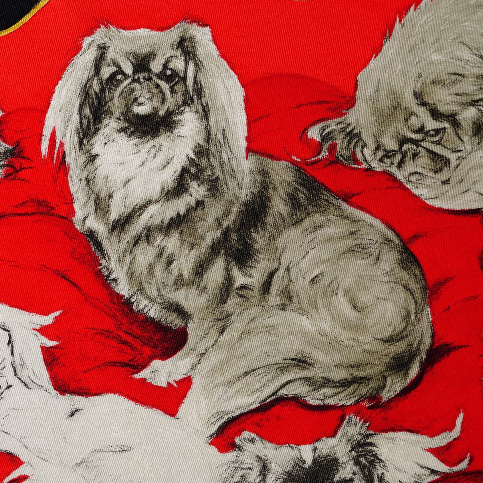 Zoom sur les illustrations de chien de face du foulard Hermès Pékinois 1965.